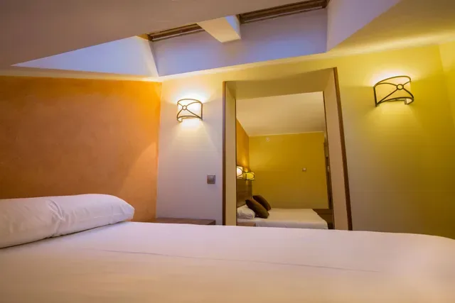 Bedroom shown with the Hotel Màgic Pas offer