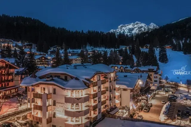 SportHotel Romantic Plaza and surrounding resort at dusk