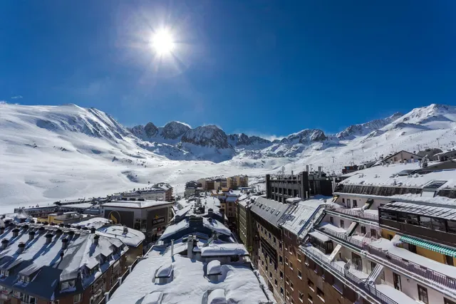Snow-covered Pas de la Casa and surrounding mountains